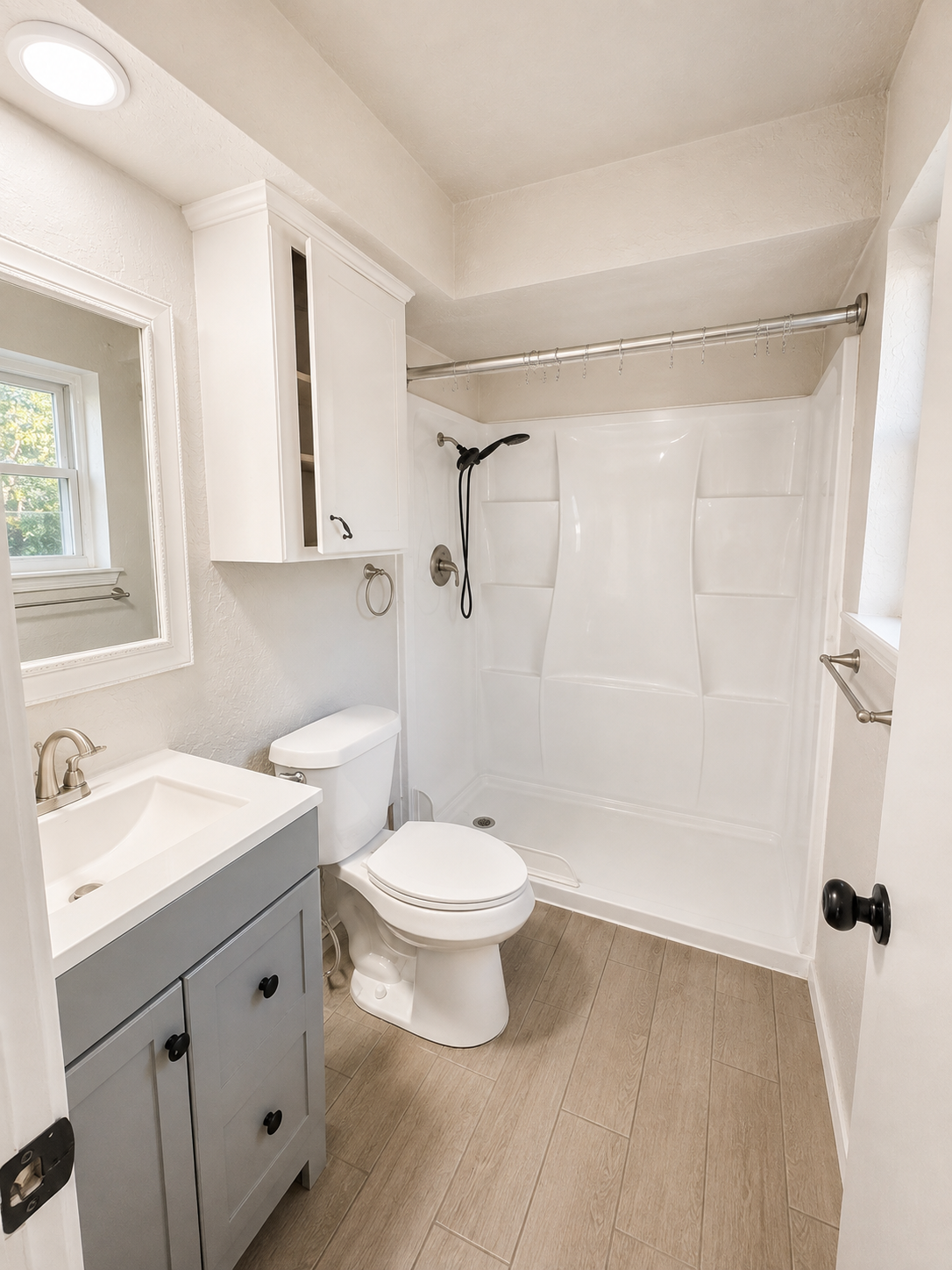 Bathroom with vanity and tub-shower combination