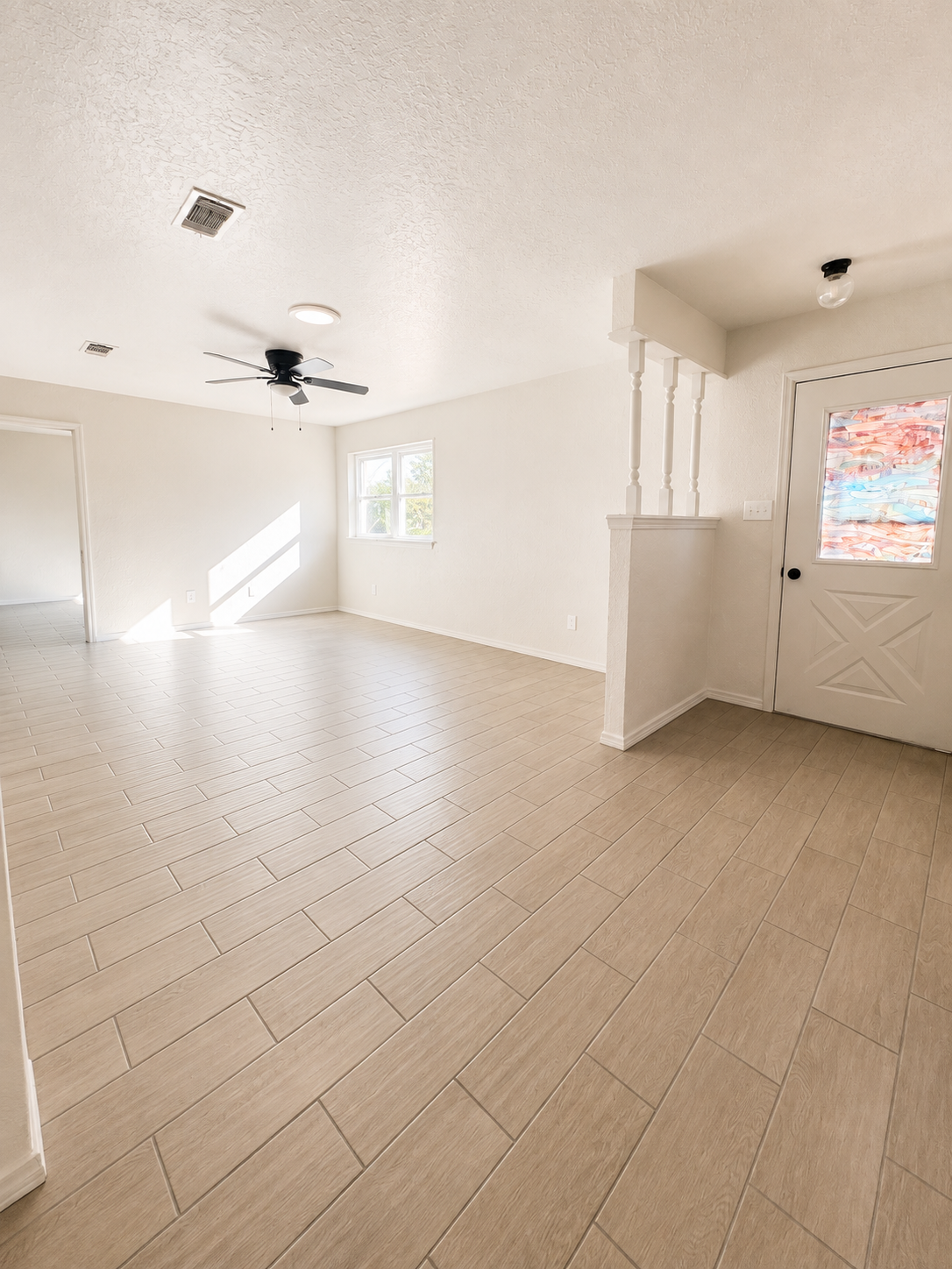 Alternate view of the living room and entry